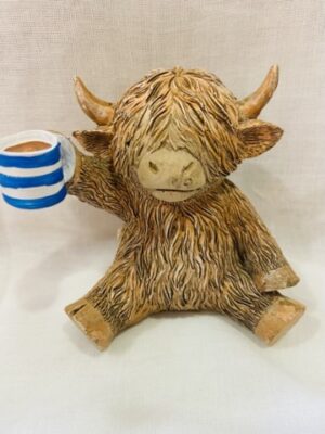 Highland Cow Holding A Cuppa