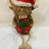 Dangly Leg Highland Cow Holding Gifts