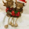 Christmas Couple Of Highland Cows With Dangly Legs Giving Gifts