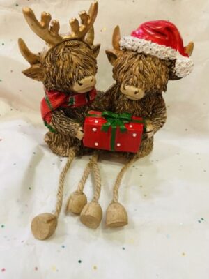 Christmas Couple Of Highland Cows With Dangly Legs Giving Gifts