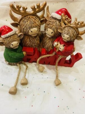 Family Of Highland Christmas Cows With Dangly Legs