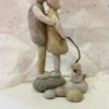 Stone Kissing Couple With Dog