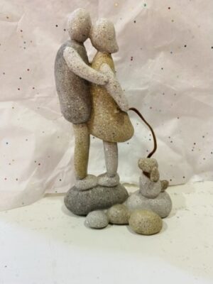 Stone Kissing Couple With Dog