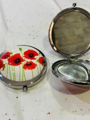 Lots Of Stemmed Poppies On A Magnifying Mirrored Compact