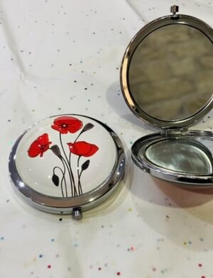 Trio Of Budded Stemmed Poppies On A Magnifying Mirrored Compact