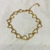 Multiple Gold Hearts On A Short Chain Necklace